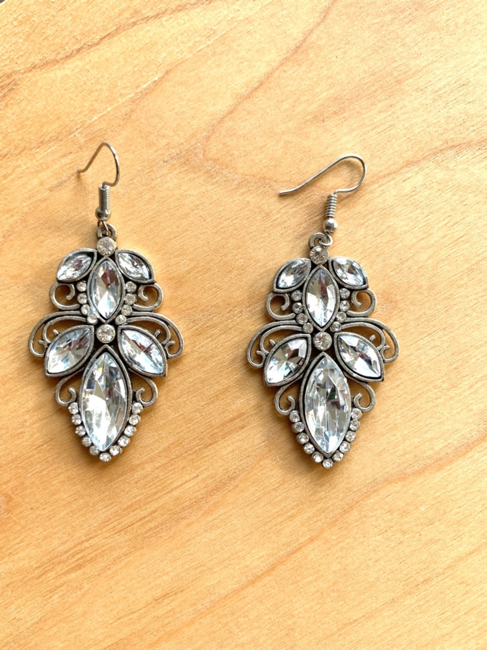 faux diamond crystal sparkle scrolled metal silver tone elegant fancy earrings